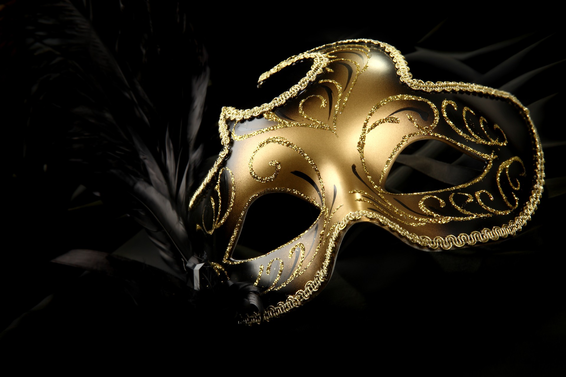 A beautiful carnival masks with black feather and gold decor